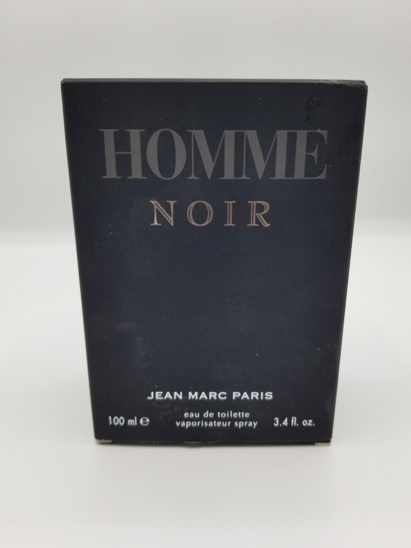 A bottle of jean marc paris homme noir perfume.