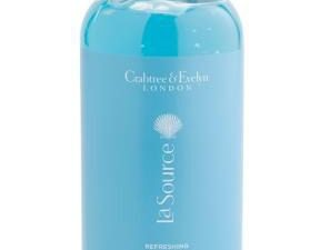 A CRABTREE & EVELYN La Source Body Wash 17oz with a blue bottle on a white background.