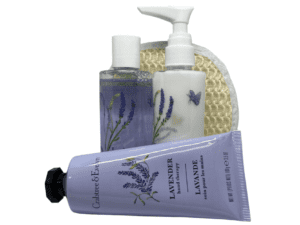 A CRABTREE & EVELYN 3pc Lavender Hand Therapy Body Wash And Lotion Essentials Collection, including two pump bottles and a tube of cream, displayed in front of a textured sponge. Set cleanses and moisturizes skin.