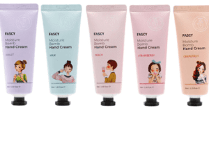 Five tubes of Maske Lab FASCY Assorted Tree Moisture Bomb Hand Cream with variations of lilac, peach, mint, strawberry, and grapefruit, each illustrated with different animated female characters.