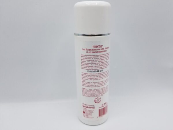 A Maxi Tone Essential 24H Nutri-Serum Lightening Lotion with a white label on it.