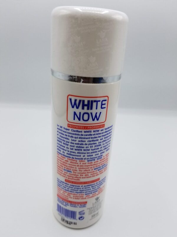 A White Now Super Fast Clarifying Lotion spray bottle on a white surface.