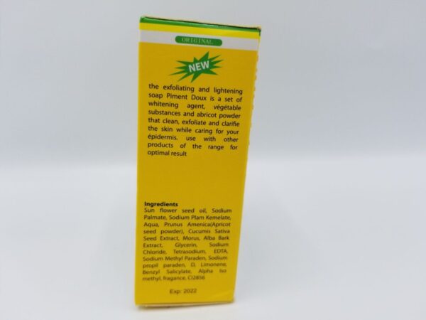 The back of a Piment Doux Exfoliating and Lightening Soap box with a yellow label on it.