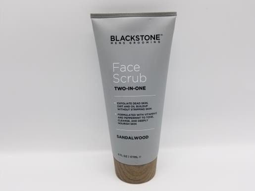 A tube of BLACKSTONE Men's Face Scrub Two-In-One, Sandalwood - 6 Oz on a white background.