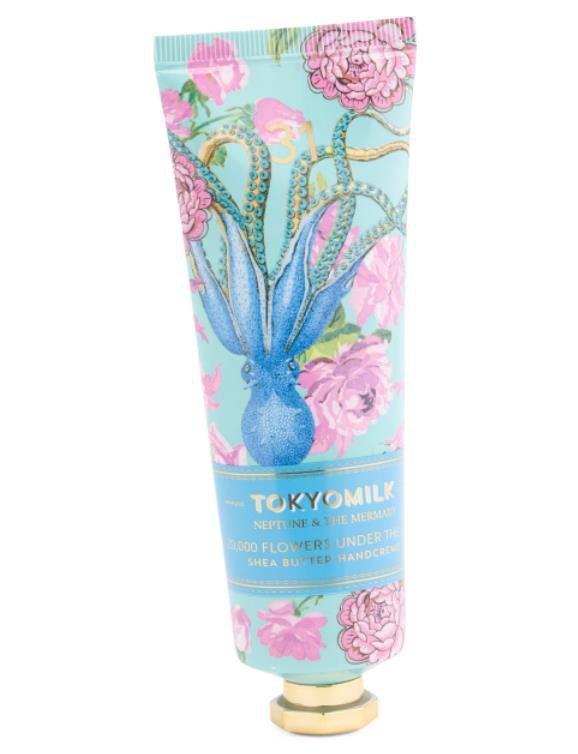 A tube of Tokyo Milk Neptune & the Mermaid Hand Creme 2.7oz - 20,000 Flowers Under The Sea with an octopus on it.