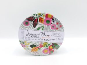 A LIBRARY OF FLOWRES WILDFLOWER Parfum Crema 2.5oz with a floral design on it.