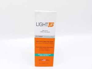 A box of LIGHT UP DARK SPOTS CORRECTING SERUM on a white background.