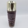 A bottle of LALALA LOTION GOMMANTE ET ECLAIRCISSANTE AUX ACIDES DE FRUITS 100ml with a brown lid on a white background.