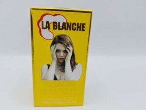 A yellow box with LA BLANCHE KENACOL LA BLANCHE SOLUTION POUR APPLICATION CUTANEE on it.