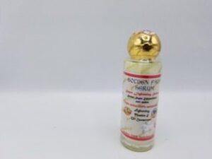 A small bottle of Golden Face Serum with a gold lid.