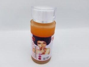 A bottle of White Secret Serum Concentré with a woman's face on it.