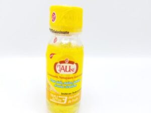 A bottle of PEAU JAUNE Gommante, Nettoyante Anti-taches Triple action on a white background.