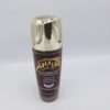 A LALALA LOTION GOMMANTE ET ECLAIRCISSANTE AUX ACIDES DE FRUITS  100ml with a gold lid on a white background.