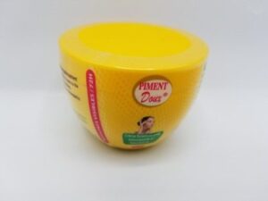 A yellow Piment Doux Lightening, Smoothing, and Rejuvenating Cream container with a lid on it.