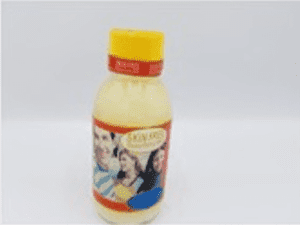 A bottle of SKIN FREE Beautifying Milk - 'Extra Bleaching Oil' Huile Extra Éclaircissante with a yellow label on it.