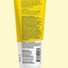 A tube of Acure Brightening Facial Scrub - 4 Fl Oz on a yellow background.