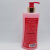 A pink bottle of Biopur Paris clarifying shower gel for dark areas with French labeling and a pump dispenser, set against a plain white background.