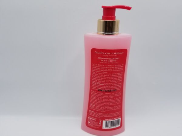 A pink bottle of Biopur Paris clarifying shower gel for dark areas with French labeling and a pump dispenser, set against a plain white background.