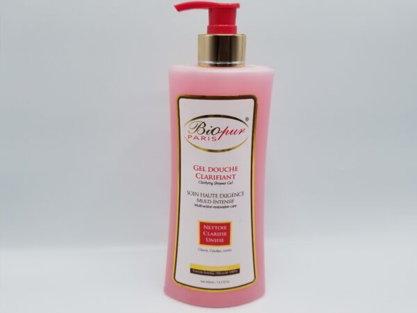 A pink bottle of Biopur Paris Clarifying Shower Gel - 400ml for dark areas with French text, featuring a pump dispenser.