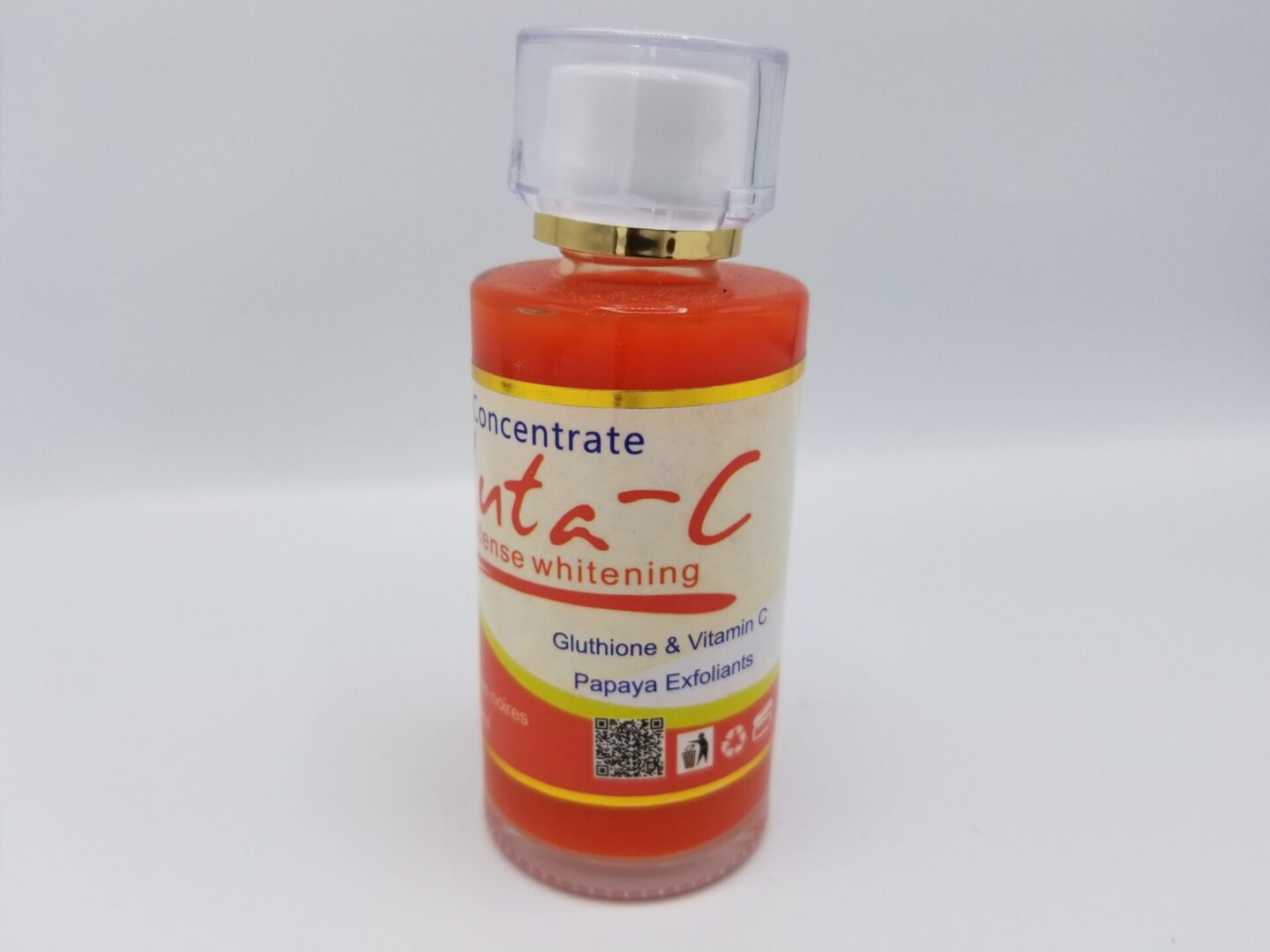 A bottle of Gluta-C Intense Whitening Concentrate - 100ml with glutathione, vitamin c, and papaya exfoliants, featuring a qr code on the label.