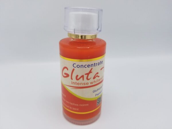 A small orange bottle of "Gluta-C Intense Whitening Concentrate" skin whitening serum with a white cap, set against a neutral background.