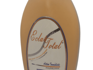 A single bottle of Eclat Total Immediate Action Lightening Body Lotion 2in1 - 500ml with a beige and white label on a transparent background.