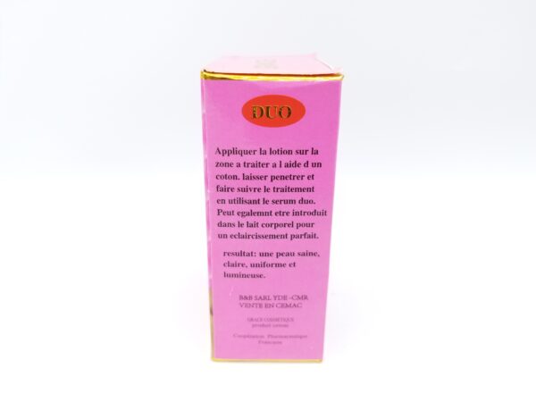 A pink box of Duo Grace Serum & Lotion for dark spot removal and skin lightening, with French instructions on its usage and benefits.