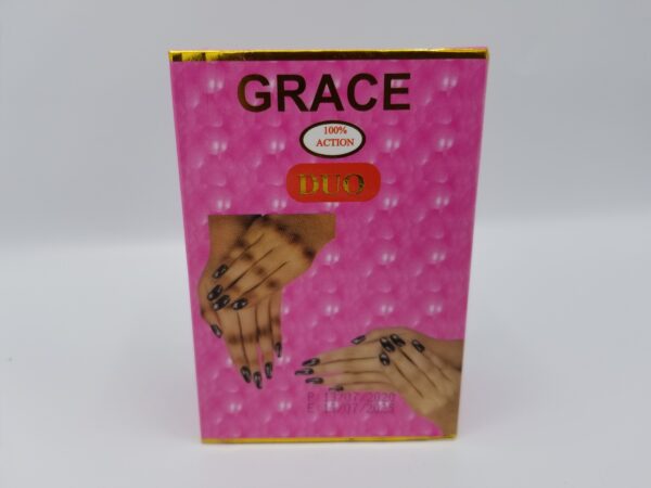 A box labeled "Duo Grace Serum & Lotion - Dark Spot Remover" featuring an image of two hands with polished nails on a pink background.