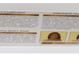 Box of Gold Skin Clarifying Body Soap with Argan Oil - 180g/6.08oz featuring descriptions in french and english, with images of a woman before and after using the product.