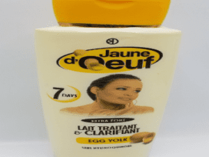 Container of Jaune d'Oeuf Extra Strong Treatment & Clarifying Milk - 450ml, labeled in french, featuring an image of a woman on the front.