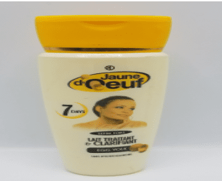 Jar of Jaune d'Oeuf Extra Strong Treatment & Clarifying Milk with a yellow lid, labeled in french, featuring an image of a woman's face on the label.