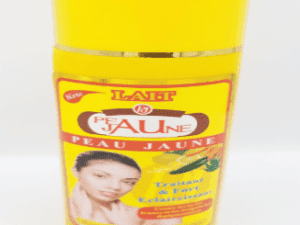 A yellow bottle of Peau Jaune Lait Traitant & Fort Eclaircissant 500ml skin lightening cream with a picture of a woman's face and text detailing product benefits.