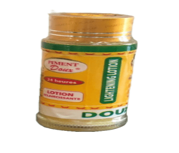 A jar of Piment Doux 24 Heures Whitening Lotion with a yellow label.