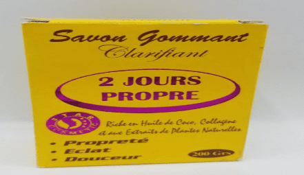 Box of "2 Jours Propre Savon Clarifying Scrub Soap 2 DAYS CLEAN" soap, highlighting its key ingredients like coconut oil and plant extracts, aimed at skin clarity and softness.