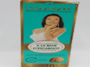 A box of Gold Skin Clarifying Body Lotion with Snail Slime, featuring an image of a woman on the front. The packaging is gold and blue with text in French.