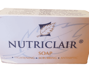 A box of Nutriclair Lightening Scrubbing Antiseptic Soap 165g with labels emphasizing its lightening, scrubbing, and antiseptic properties, displayed against a green background.