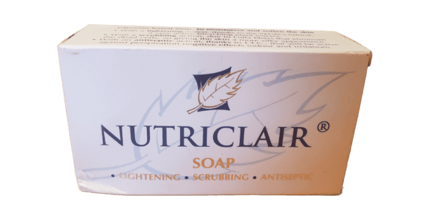 A box of Nutriclair Lightening Scrubbing Antiseptic Soap 165g with labels emphasizing its lightening, scrubbing, and antiseptic properties, displayed against a green background.