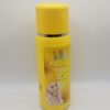 A yellow bottle of lotion with a picture on it.