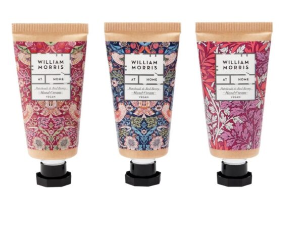 Three different hand creams with a floral design on them.